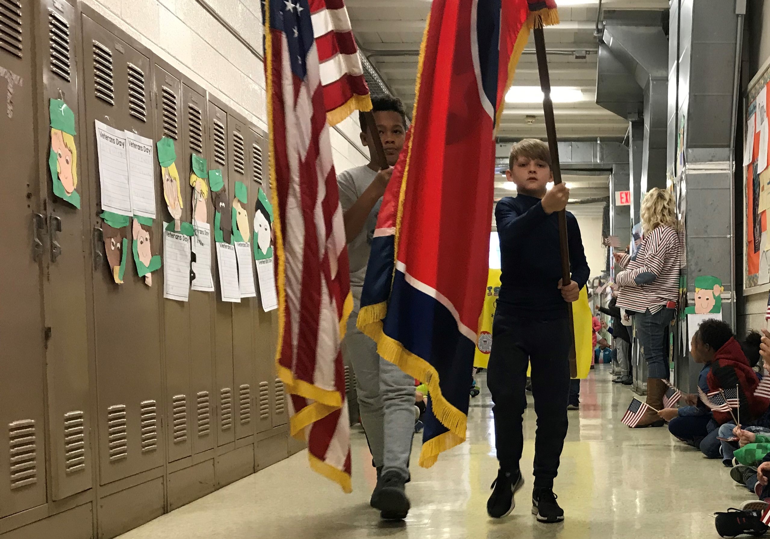 Detrick Grove and Peyton Brookshire, 5th-graders at Pleasant Ridge Elementary School, lead a Veterans Day parade on Nov. 12, 2018. 